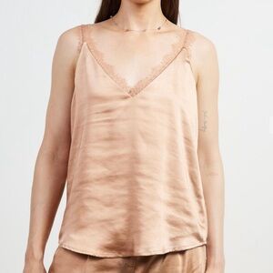 New with tags. Lace trim satin cami. Almond color. Skies are Blue